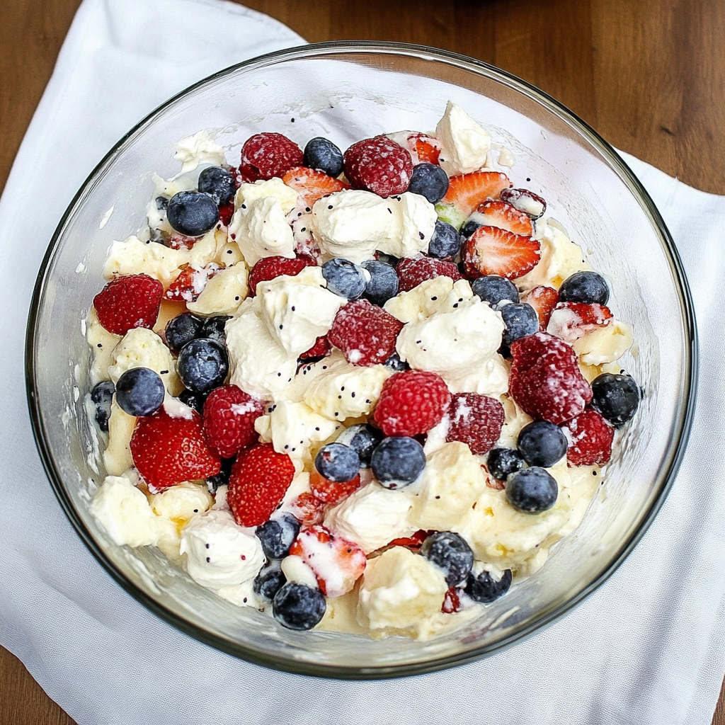 Recipe preparation for Red White & Blue Cheesecake Salad